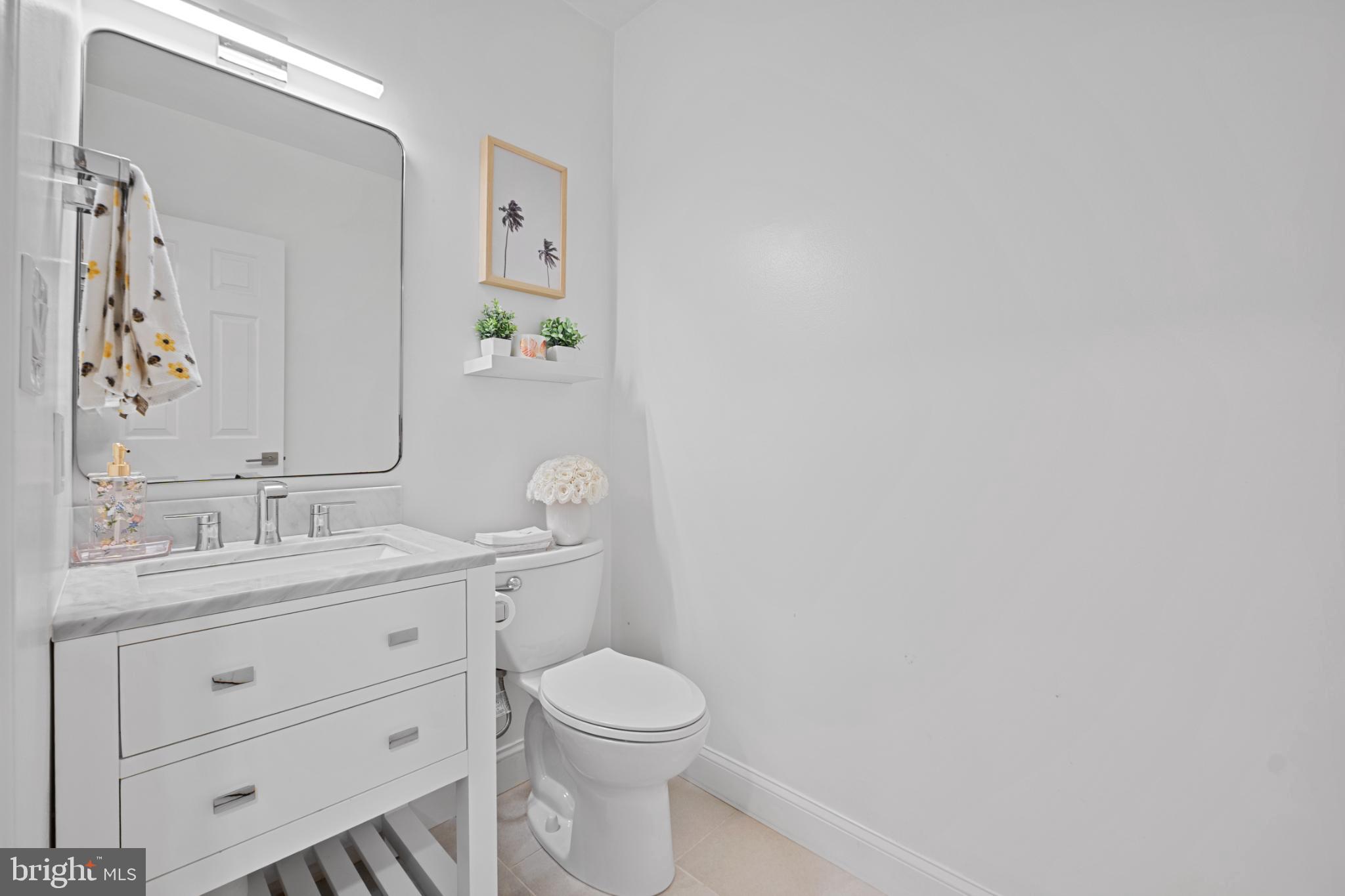 4311 Massachusetts Avenue Northwest Washington, DC 20016 - Photo 14 of 30 Sleek, modern bathroom with bright accents.