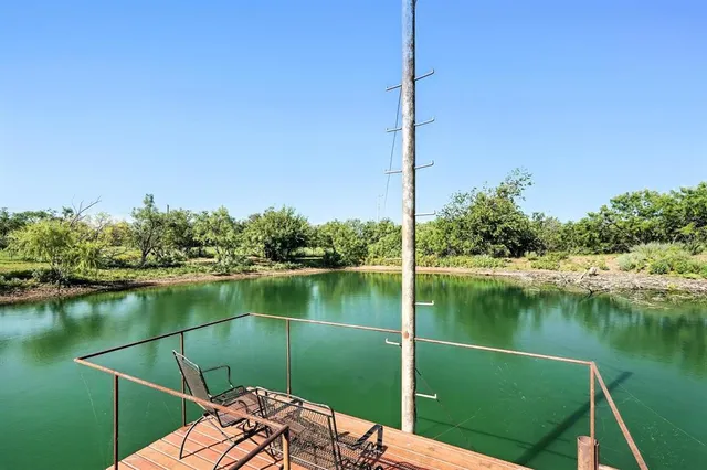 a view of a backyard with sitting area