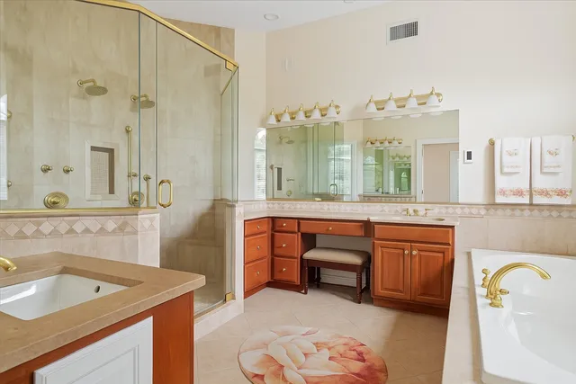 a bathroom with a sink double vanity and a mirror