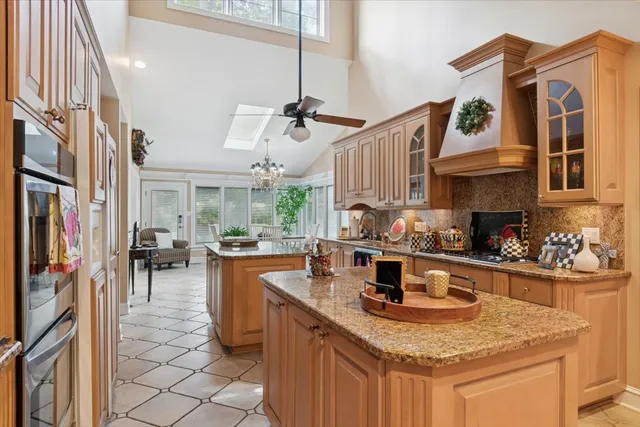 a kitchen with a sink appliances and cabinets
