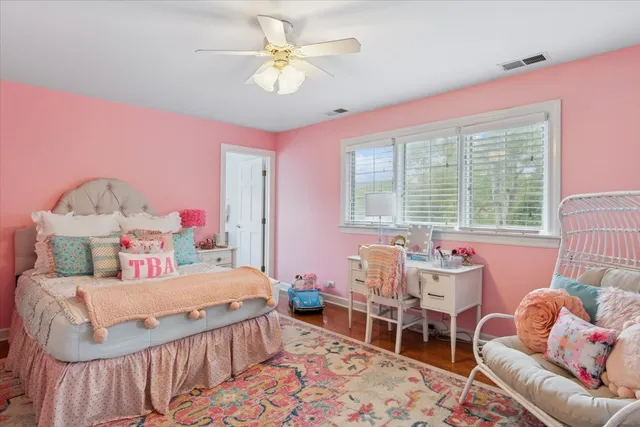 a bedroom with a bed and a table