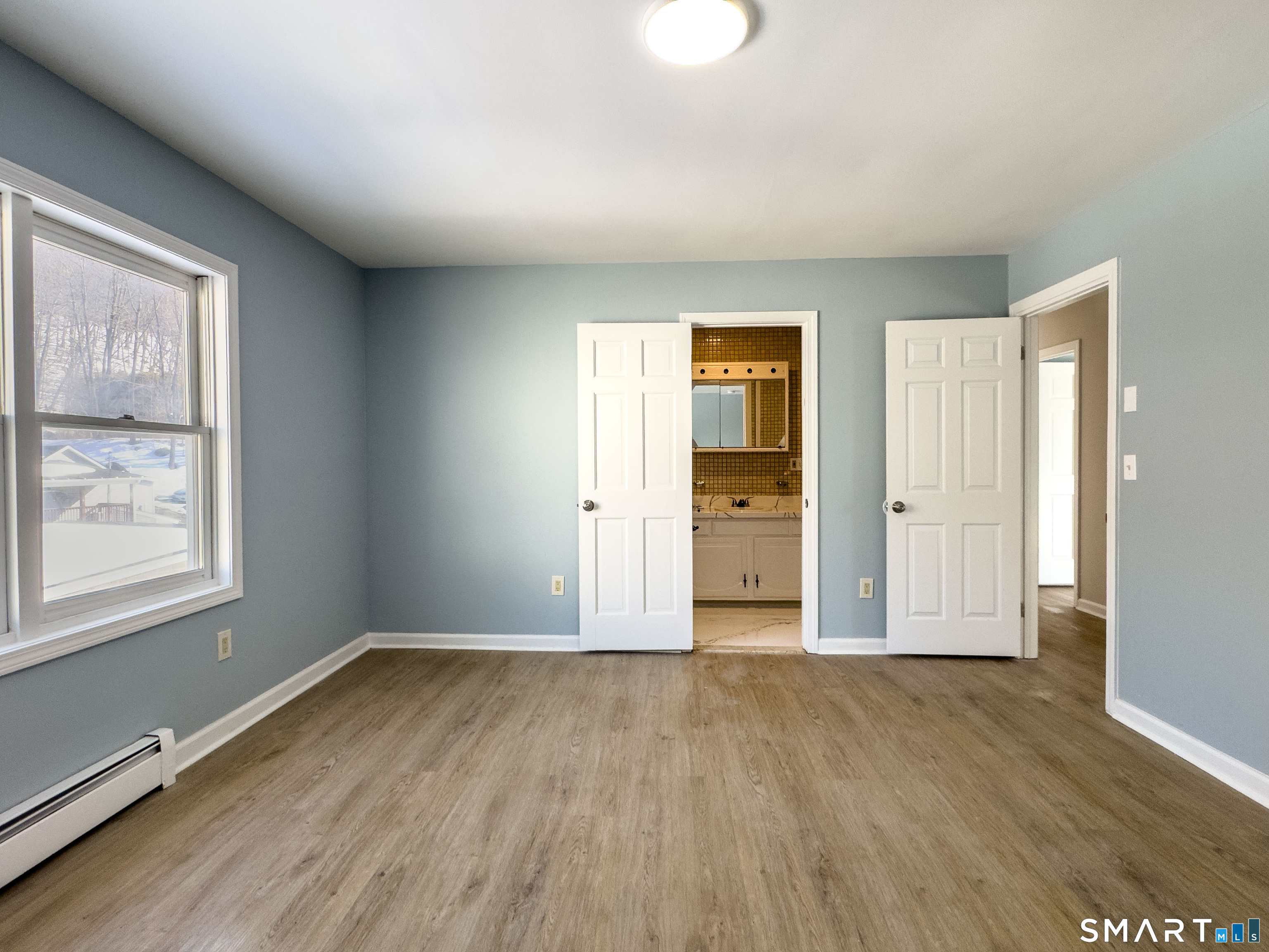 53 High Street Naugatuck, CT 06770 - Photo 14 of 28 an empty room with wooden floor and windows