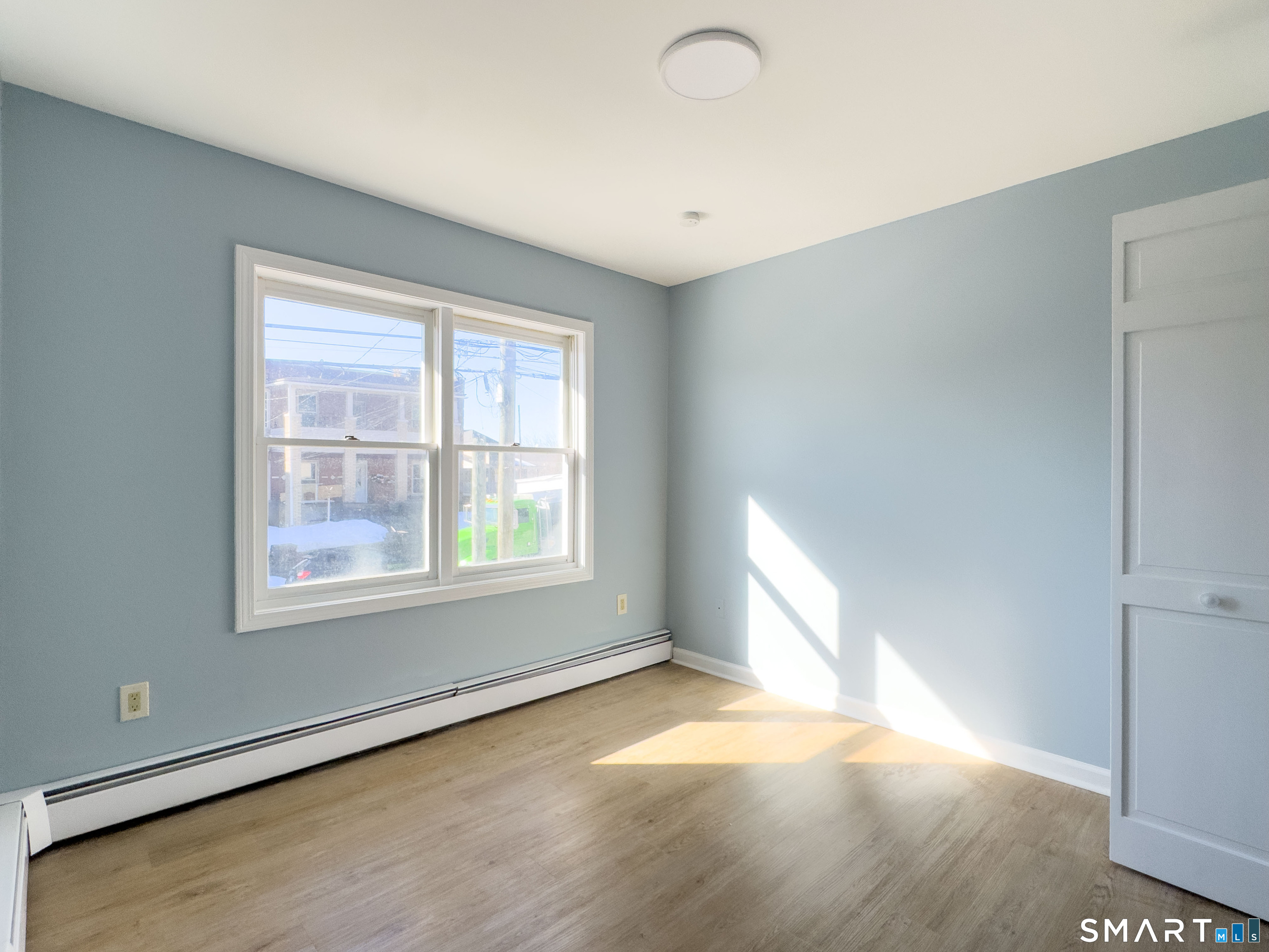 53 High Street Naugatuck, CT 06770 - Photo 17 of 28 a view of an empty room with a window