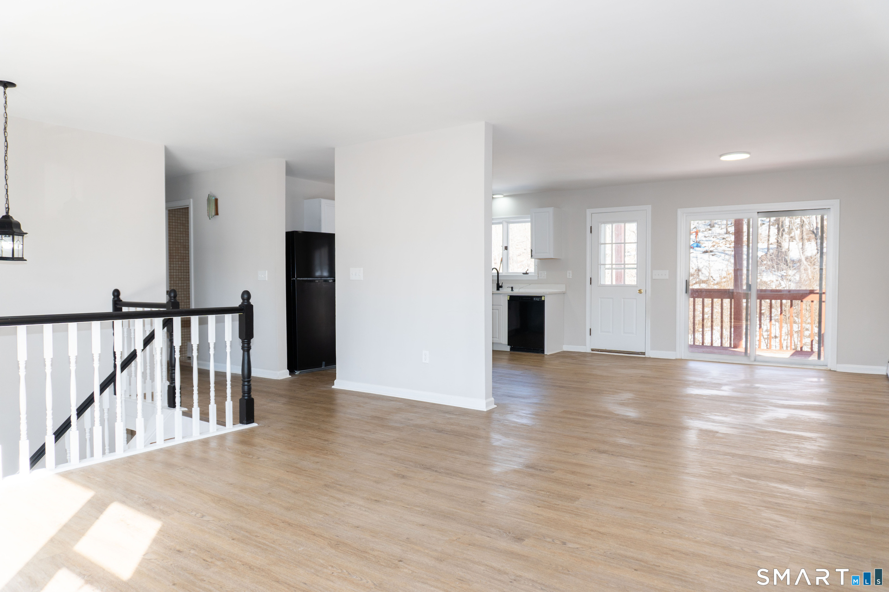 53 High Street Naugatuck, CT 06770 - Photo 3 of 28 a view of an empty room with wooden floor and a window