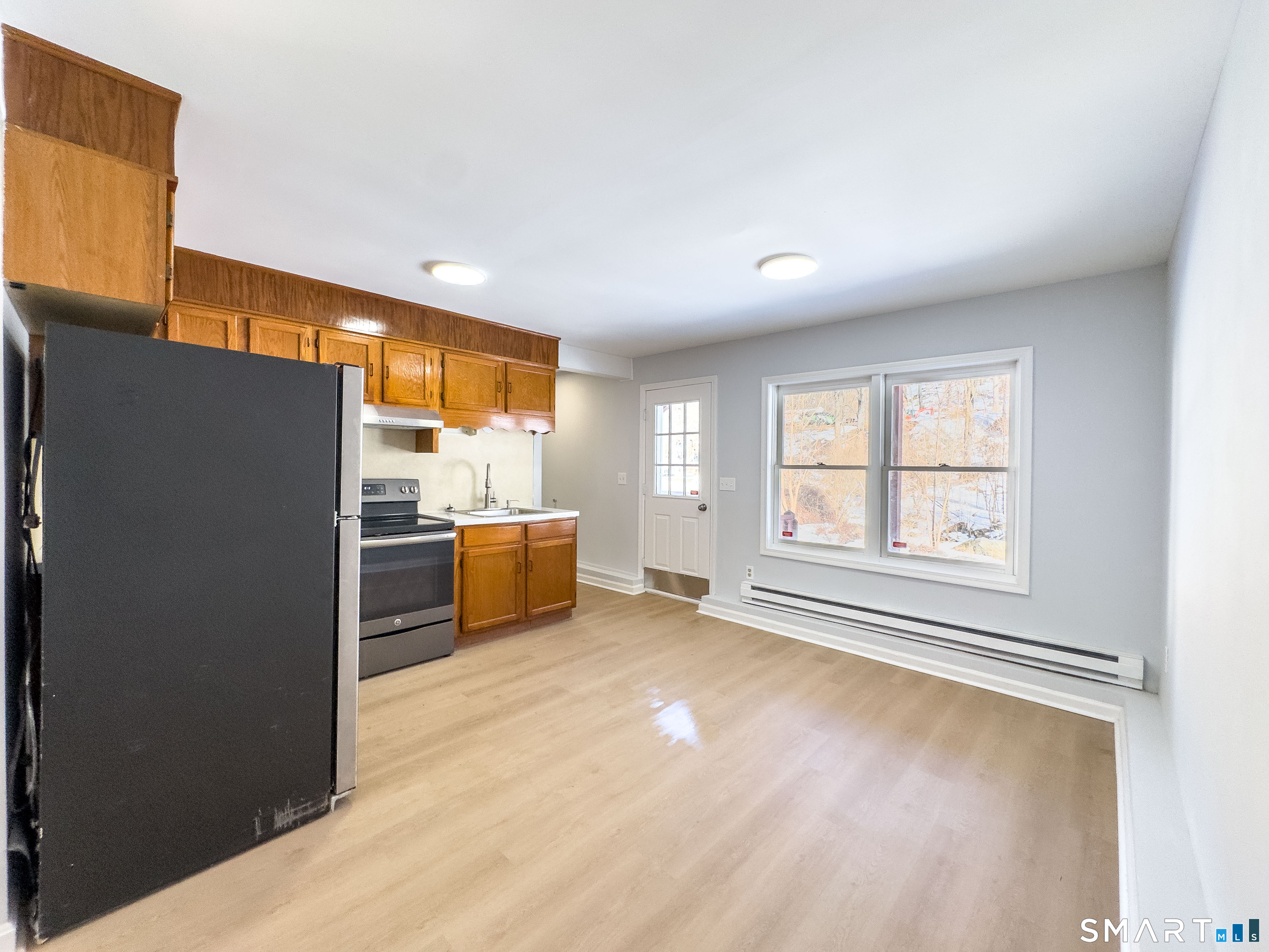 53 High Street Naugatuck, CT 06770 - Photo 10 of 28 a kitchen with stainless steel appliances a refrigerator and a stove