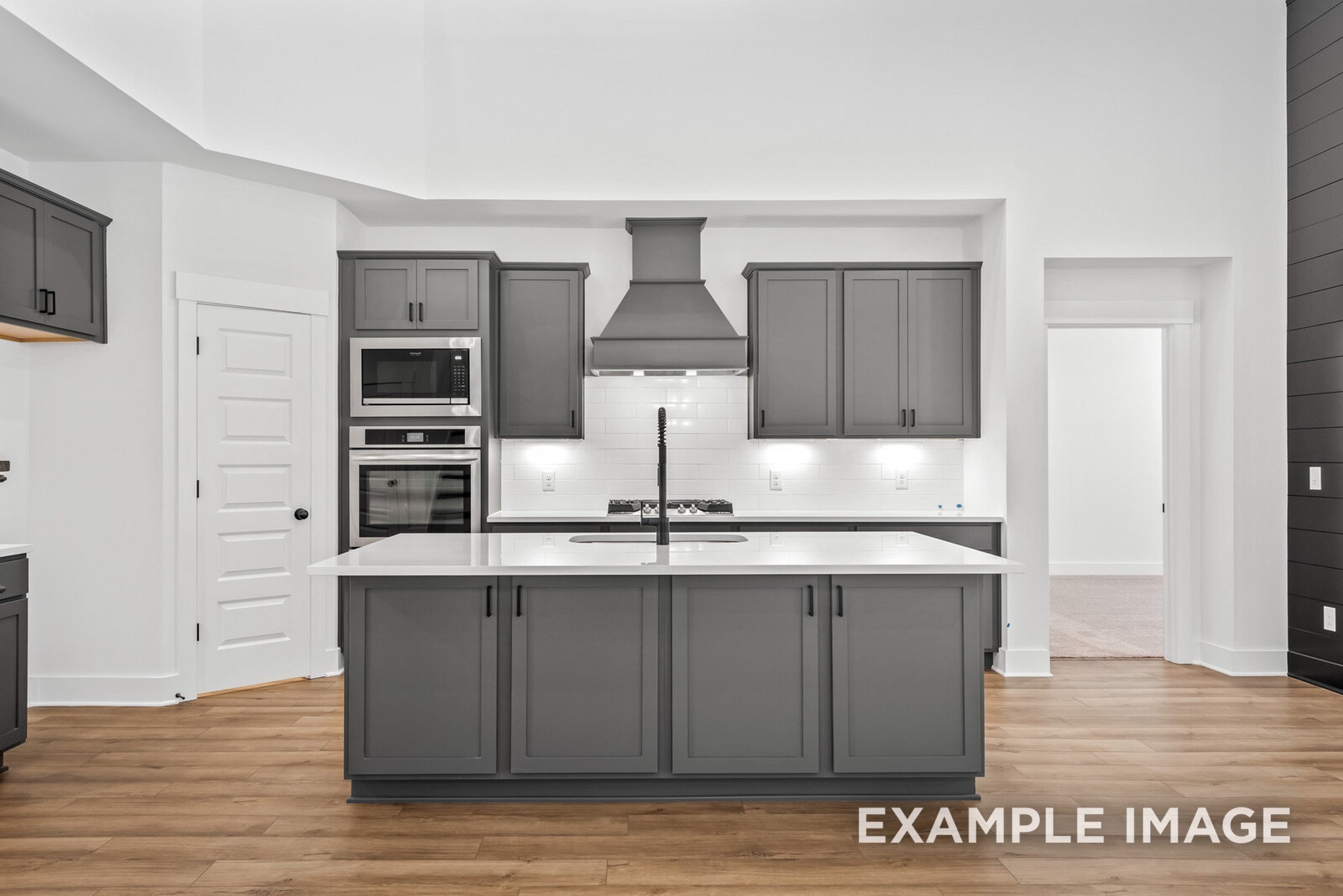 109 Rock Chimney Road Gallatin, TN 37066 - Photo 59 of 92 a kitchen with kitchen island stainless steel appliances a stove refrigerator and cabinets