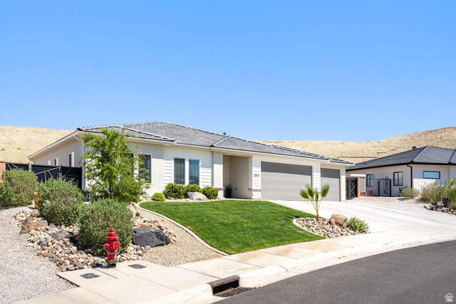5963 Flattop Drive St. George, UT 84790 - Photo 42 of 45 Contemporary single-level residence featuring a stucco exterior and a dual-bay garage