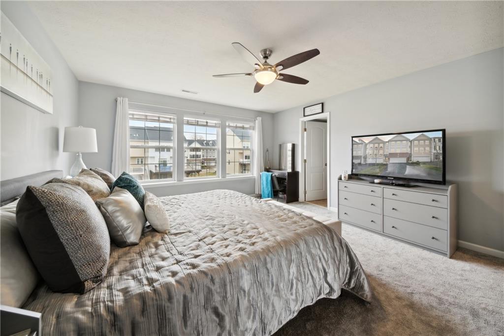 25 Truman Circle McKees Rocks, PA 15136 - Photo 12 of 25 a bedroom with a bed and a flat screen tv