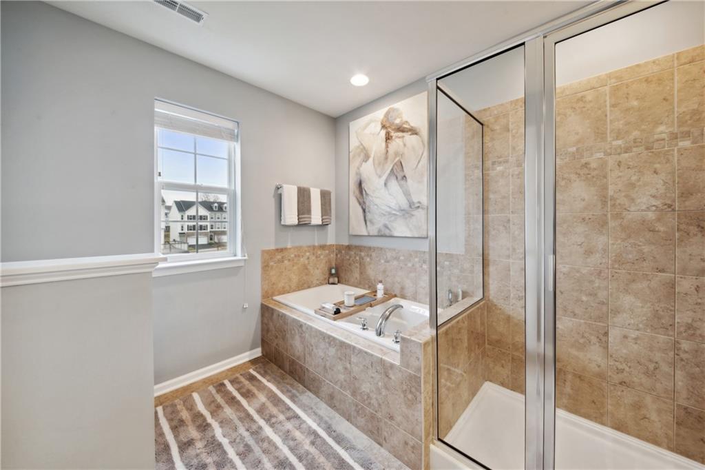 25 Truman Circle McKees Rocks, PA 15136 - Photo 13 of 25 a bathroom with a tub a sink and a window