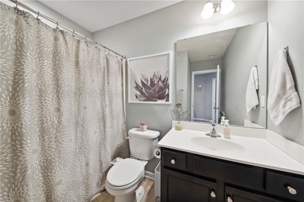 25 Truman Circle McKees Rocks, PA 15136 - Photo 16 of 25 a bathroom with a sink a toilet and a mirror