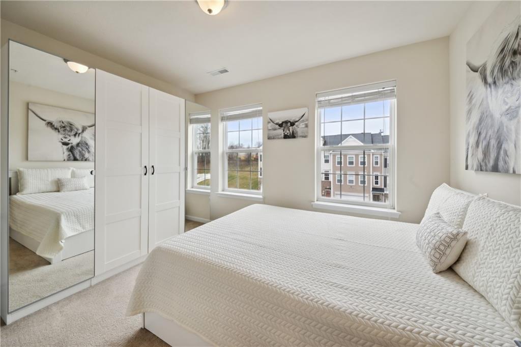 25 Truman Circle McKees Rocks, PA 15136 - Photo 18 of 25 a bedroom with a large bed and a window
