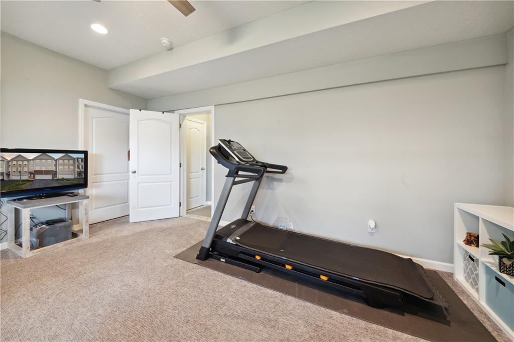 25 Truman Circle McKees Rocks, PA 15136 - Photo 21 of 25 a room with gym equipment and a flat screen tv