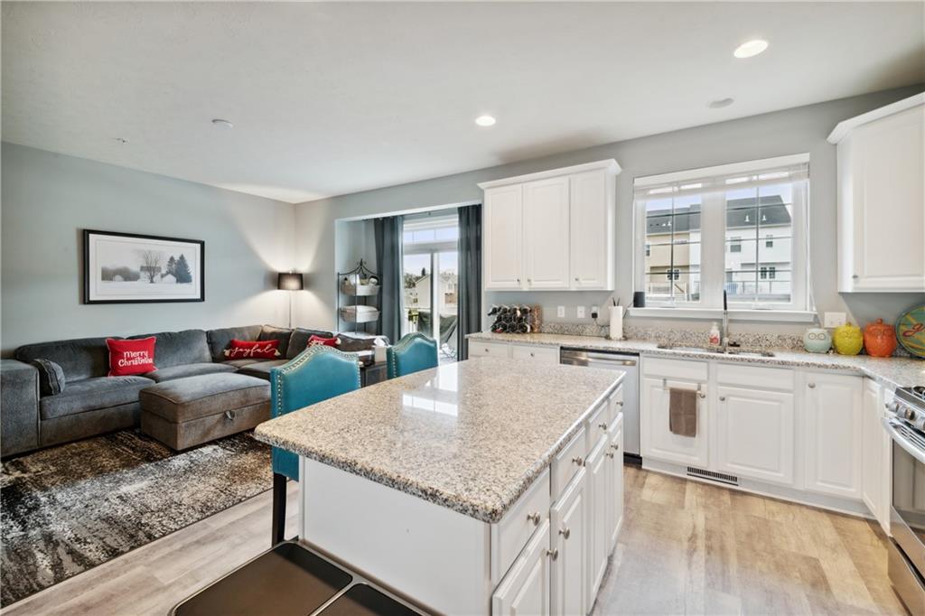 25 Truman Circle McKees Rocks, PA 15136 - Photo 5 of 25 a kitchen with stainless steel appliances granite countertop a stove and a refrigerator