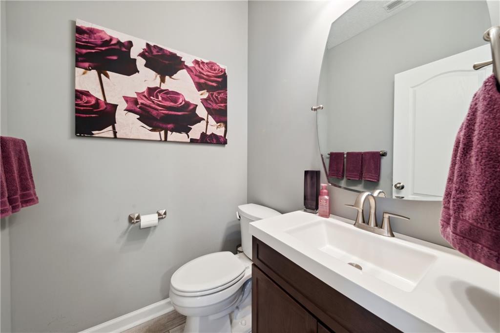 25 Truman Circle McKees Rocks, PA 15136 - Photo 9 of 25 a bathroom with a sink mirror and toilet