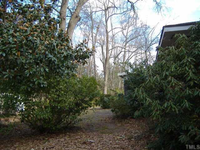 10666 Cleveland Road Garner, NC 27529 - Photo 8 of 10 a backyard of a house with lots of green space