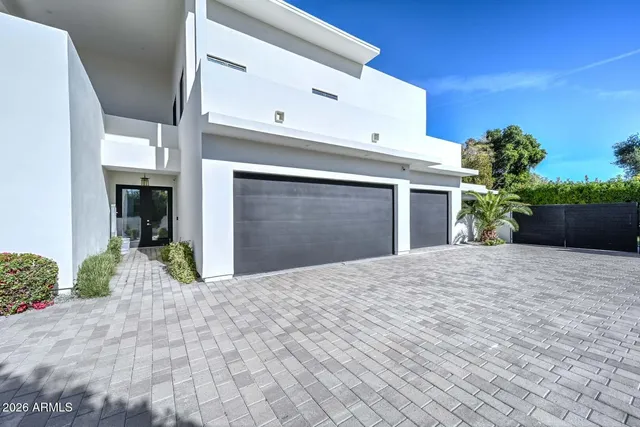 a living room with furniture and a ceiling fan