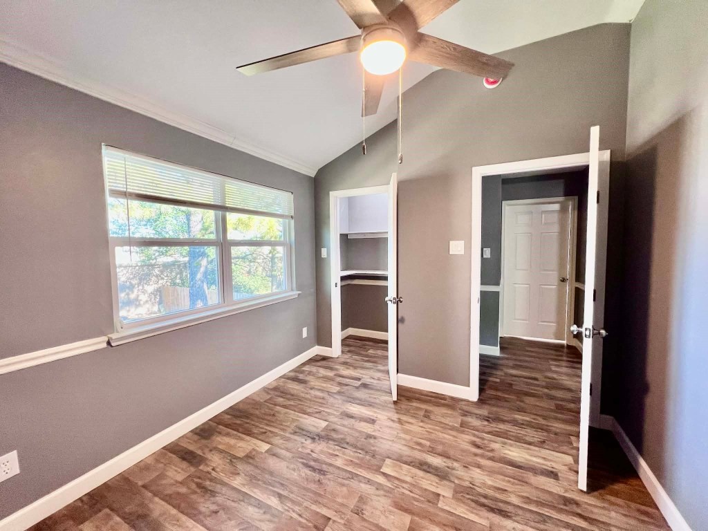 19514 Azalea Valley Drive Katy, TX 77449 - Photo 12 of 28 a view of an empty room with wooden floor and a window