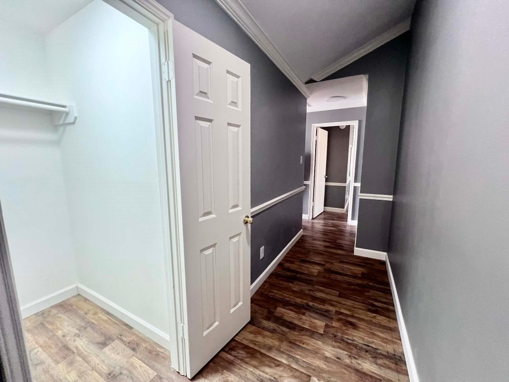 19514 Azalea Valley Drive Katy, TX 77449 - Photo 13 of 28 a view of a hallway with wooden floor and staircase