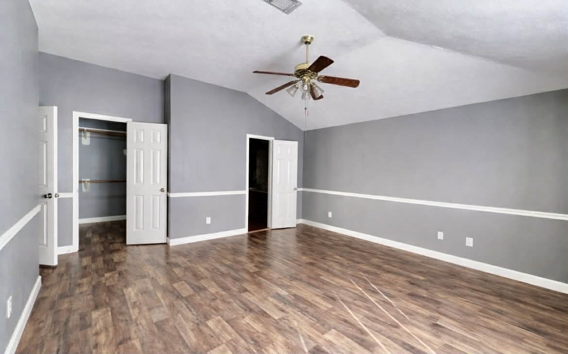 19514 Azalea Valley Drive Katy, TX 77449 - Photo 14 of 28 a view of an empty room with window and wooden floor