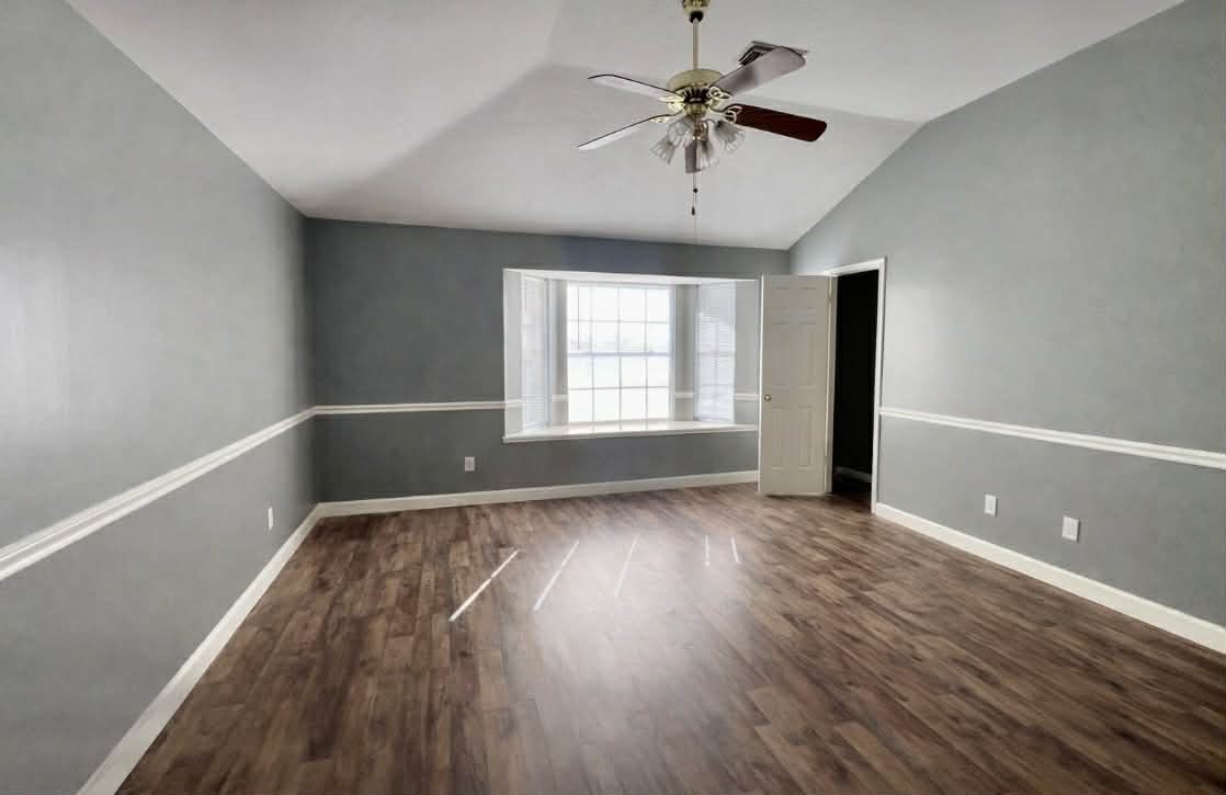 19514 Azalea Valley Drive Katy, TX 77449 - Photo 15 of 28 a view of an empty room with a window and wooden floor