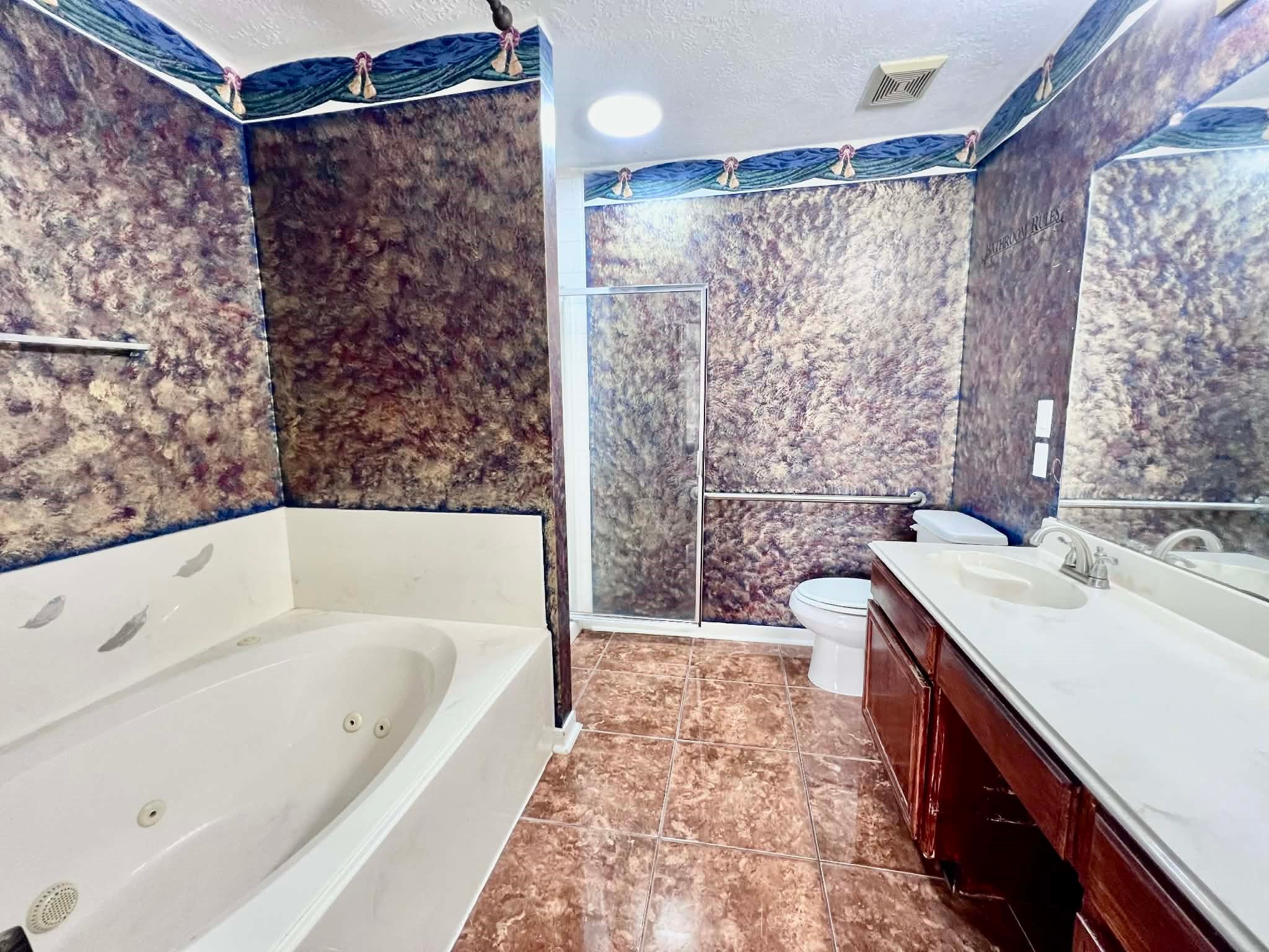 19514 Azalea Valley Drive Katy, TX 77449 - Photo 16 of 28 a spacious bathroom with a tub sink and mirror