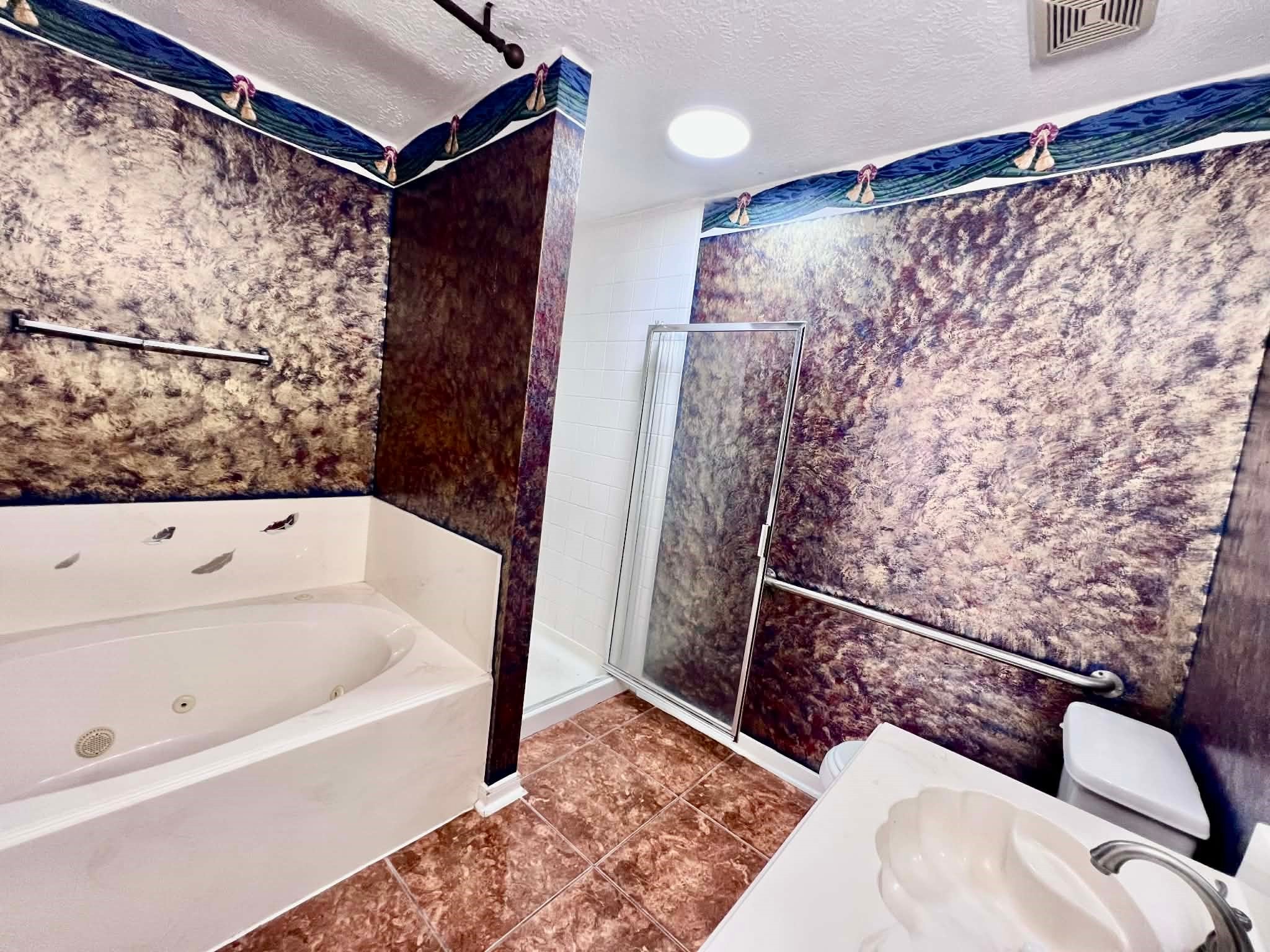 19514 Azalea Valley Drive Katy, TX 77449 - Photo 17 of 28 a bathroom with a bathtub and shower