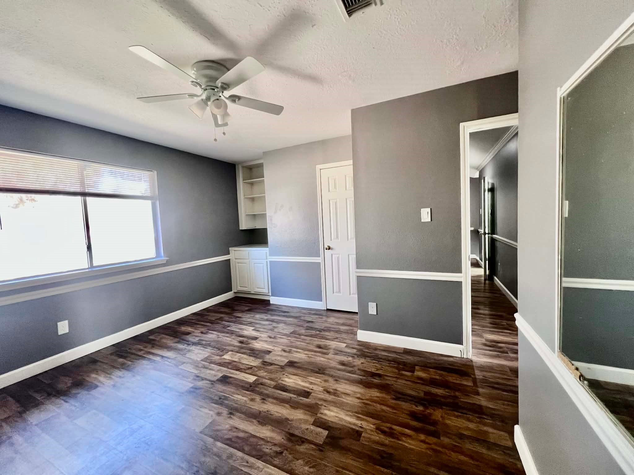 19514 Azalea Valley Drive Katy, TX 77449 - Photo 21 of 28 wooden floor in an empty room with a window
