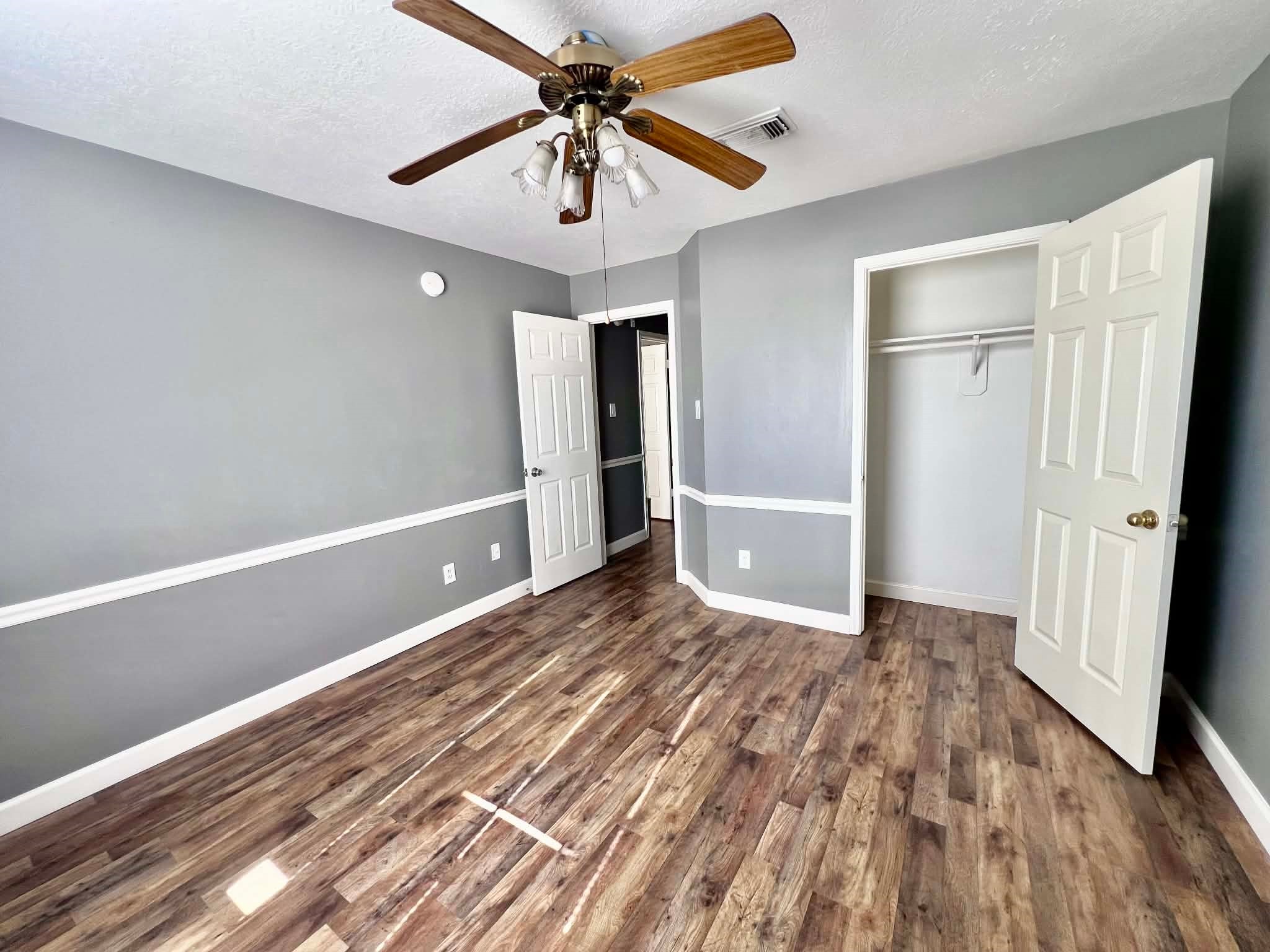 19514 Azalea Valley Drive Katy, TX 77449 - Photo 22 of 28 a view of an empty room with wooden floor