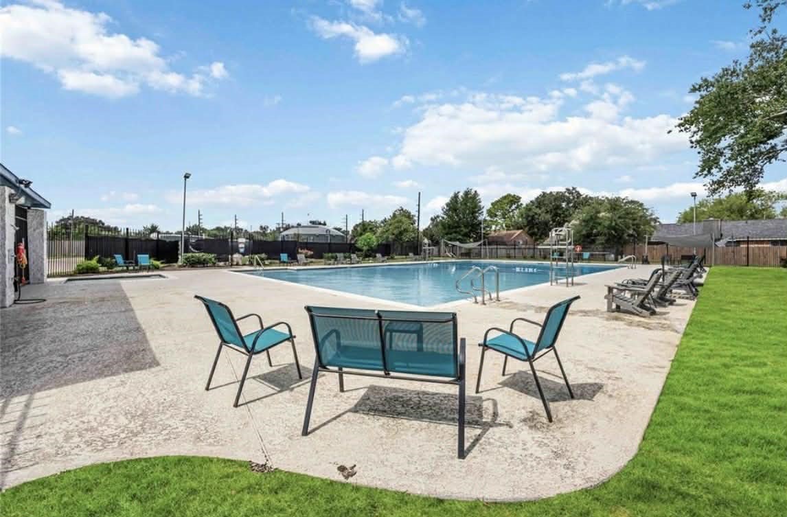 19514 Azalea Valley Drive Katy, TX 77449 - Photo 28 of 28 a view of a swimming pool with lawn chairs