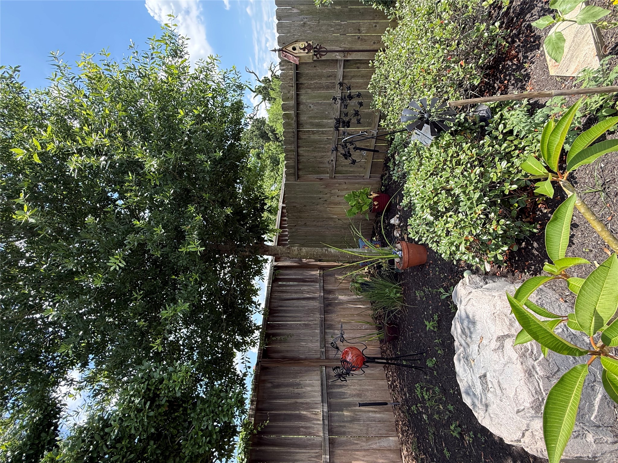 2336 Hagerman Road Conroe, TX 77384 - Photo 32 of 35 a view of garden with wooden fence