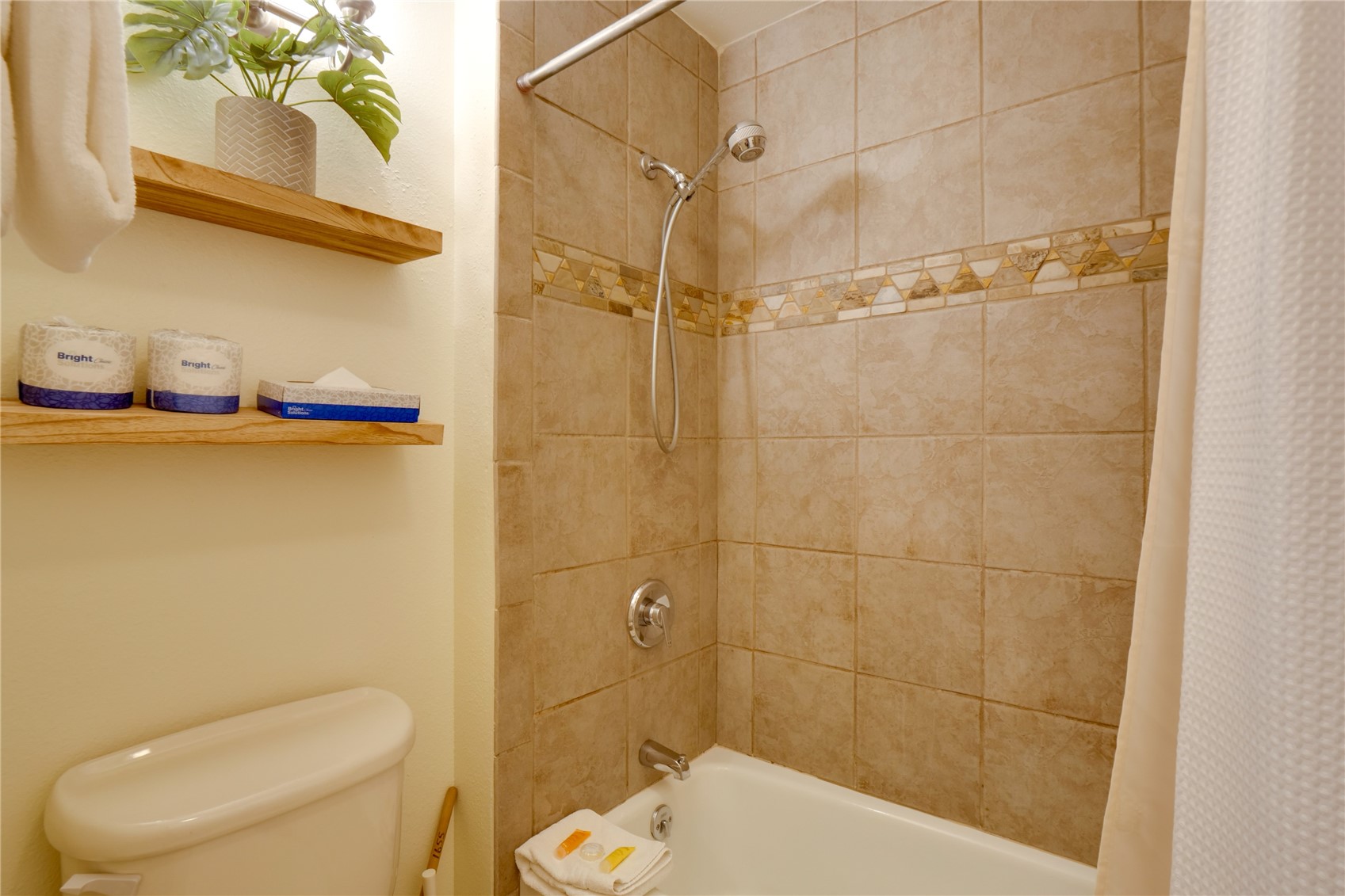 180 Tennis Club Road, Unit 1655 Keystone, CO 80435 - Photo 33 of 48 a white toilet sitting next to a bathroom sink and a shower
