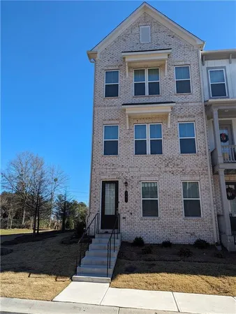 a front view of a house with yard