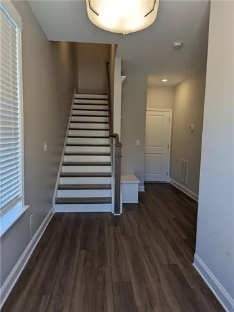 a view of entryway with wooden floor