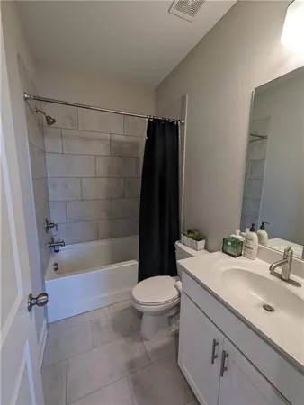 a bathroom with a sink a toilet and a bathtub