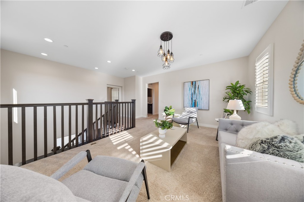 111 Lovelace Irvine, CA 92620 - Photo 23 of 55 a living room with furniture and a potted plant