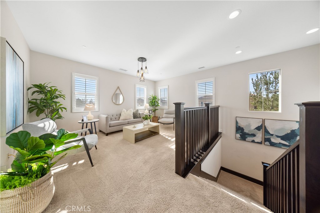111 Lovelace Irvine, CA 92620 - Photo 25 of 55 a living room with furniture floor to ceiling window and a flat screen tv