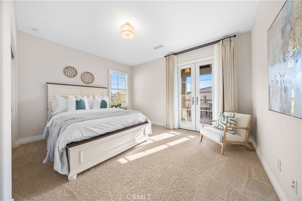 111 Lovelace Irvine, CA 92620 - Photo 29 of 55 a spacious bedroom with a bed and chair