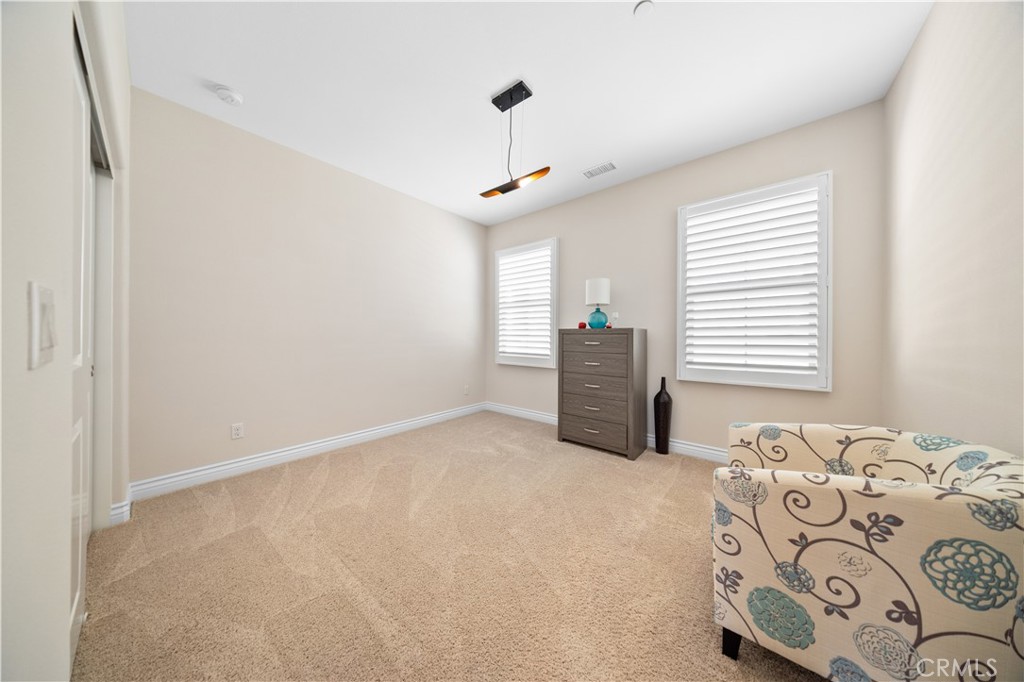 111 Lovelace Irvine, CA 92620 - Photo 30 of 55 a bedroom with a bed and a window