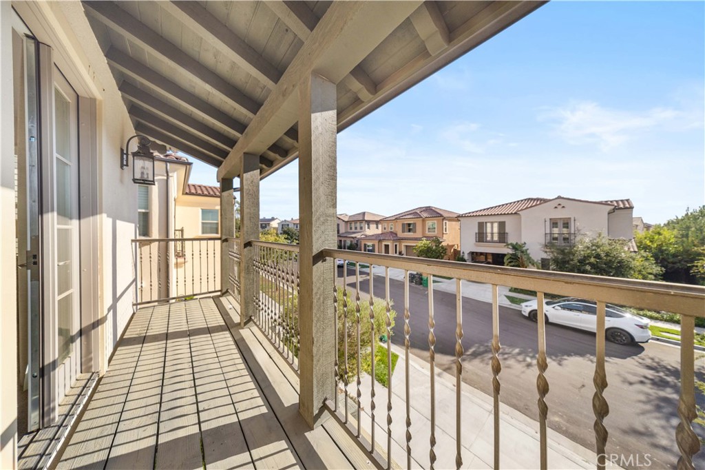 111 Lovelace Irvine, CA 92620 - Photo 32 of 55 a view of balcony with wooden floor and fence