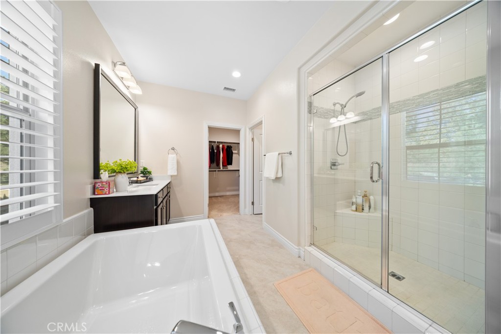 111 Lovelace Irvine, CA 92620 - Photo 35 of 55 a bathroom with a tub shower sink and mirror