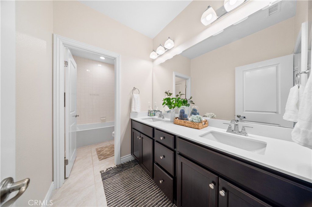 111 Lovelace Irvine, CA 92620 - Photo 40 of 55 a bathroom with a sink double vanity and a mirror