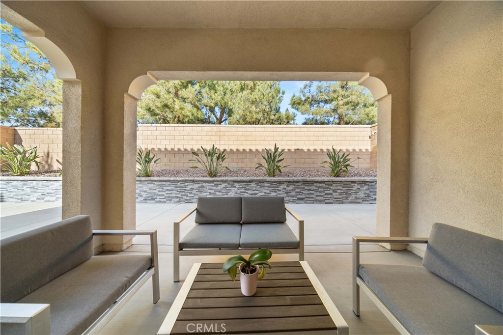 111 Lovelace Irvine, CA 92620 - Photo 44 of 55 a living room with furniture and a floor to ceiling window