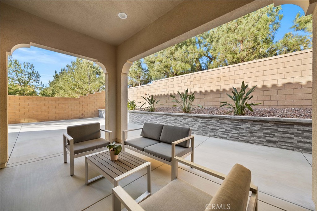 111 Lovelace Irvine, CA 92620 - Photo 45 of 55 a living room with furniture and a floor to ceiling window