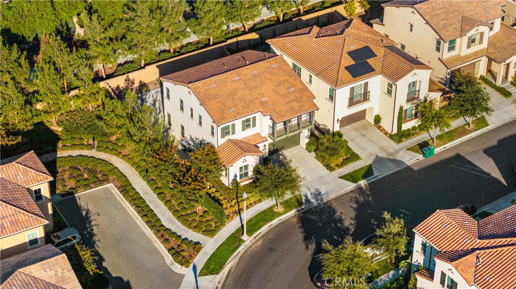 111 Lovelace Irvine, CA 92620 - Photo 47 of 55 an aerial view of a house with a yard and potted plants