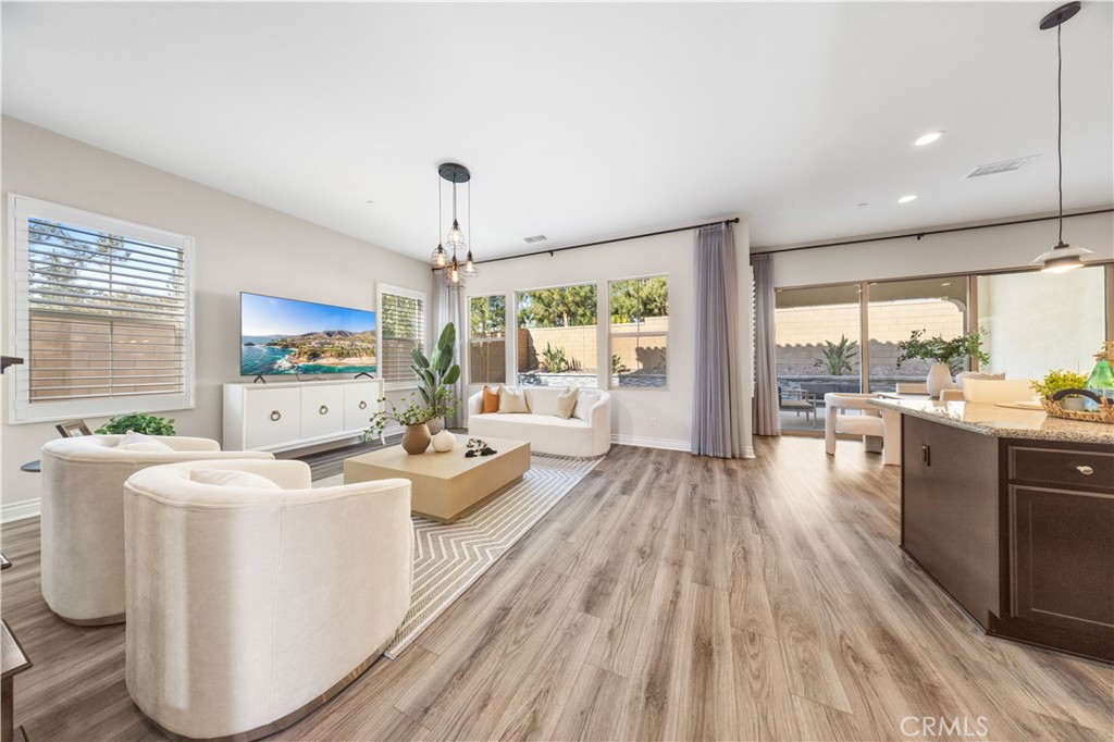111 Lovelace Irvine, CA 92620 - Photo 6 of 55 a living room with furniture wooden floor and a large window