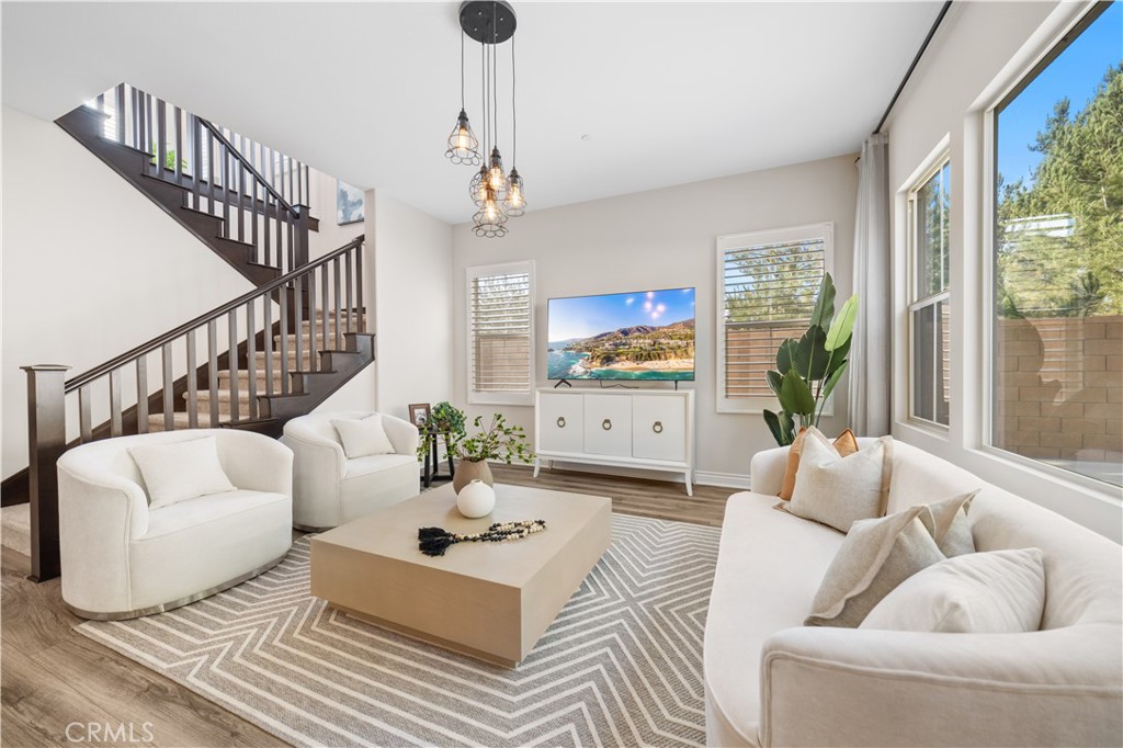 111 Lovelace Irvine, CA 92620 - Photo 8 of 55 a living room with furniture and a flat screen tv