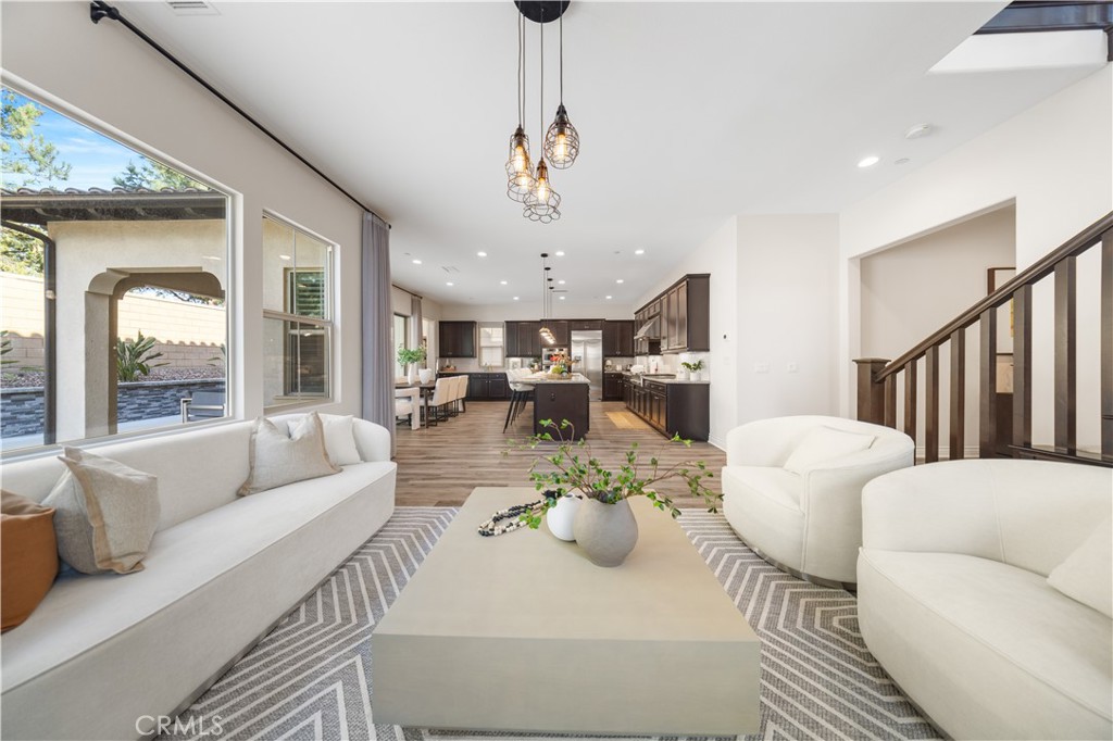 111 Lovelace Irvine, CA 92620 - Photo 9 of 55 a living room with furniture fireplace and a chandelier