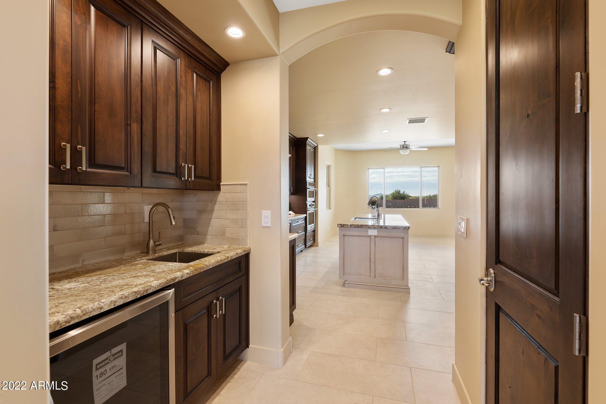 1315 West Irvine Road Phoenix, AZ 85086 - Photo 12 of 34 Wet Bar & Large Walk-in Pantry