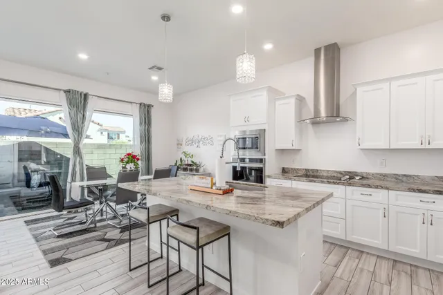a spacious bedroom with a bed and a flat screen television