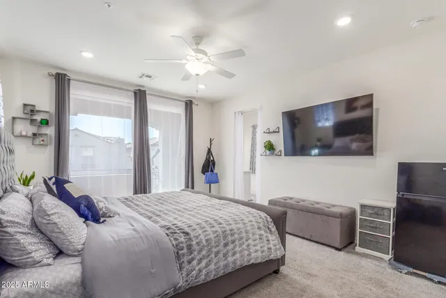 a bathroom with a sink mirror vanity and toilet